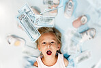Child, dollar and shoes above with wow, excited or surprise look on face in mockup for saving, sale or retail shopping. Finance, money and investment for learning, financial and education of girl