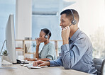 Call center, crm and phone call in office with man, woman and headphones for communication in customer service. Help, telemarketing and smile in customer support by computer, pc and keyboard at desk