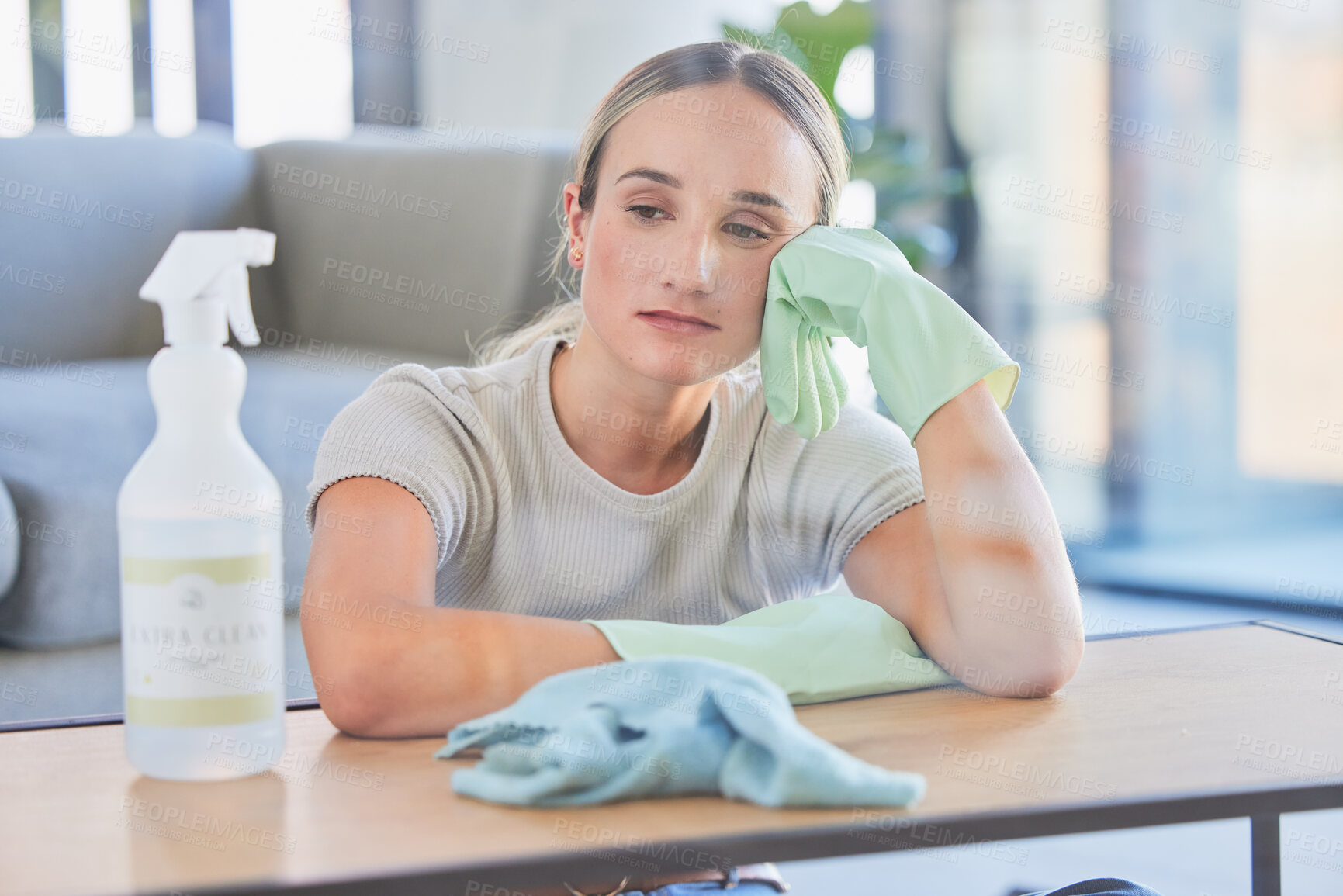 Buy stock photo Woman, tired and burnout after cleaning house, office or home with spray, chemical or sanitizer. Cleaner, gloves and table for domestic work, job or service take time to rest, breathe and relax