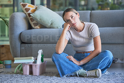 Buy stock photo Woman, tired and stress for cleaning house sitting on floor with exhausted look on face. Girl, working and burnout in home living room with headache with soap, spray and brush for domestic work