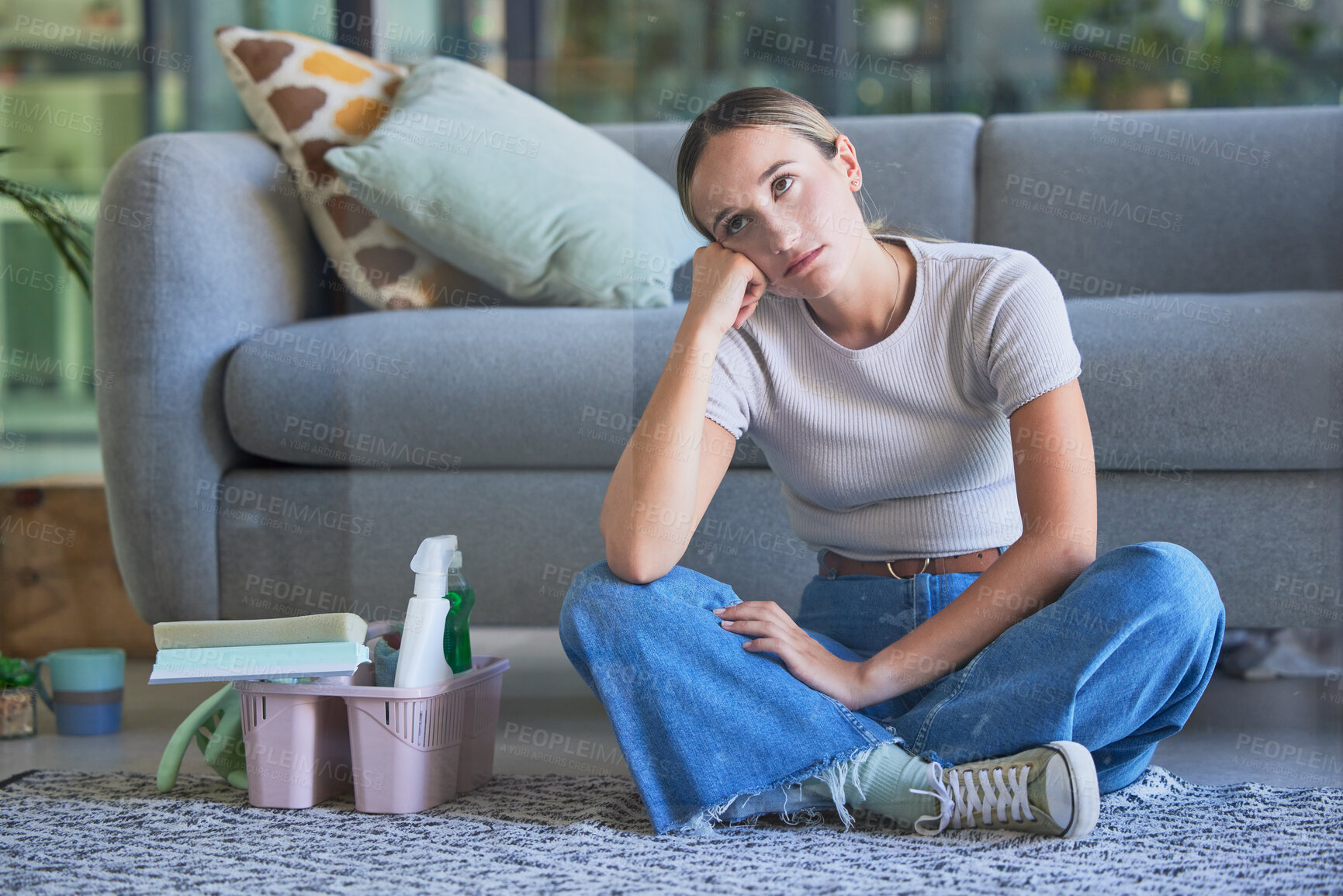 Buy stock photo Woman, tired and stress for cleaning house sitting on floor with exhausted look on face. Girl, working and burnout in home living room with headache with soap, spray and brush for domestic work