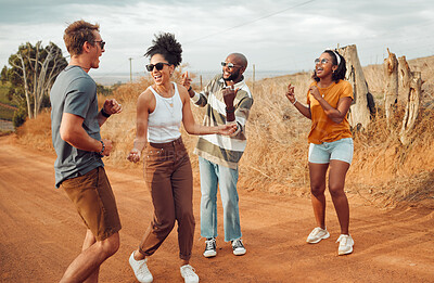 Buy stock photo Friends, dance and nature with a man and woman group having fun outdoor during travel or adventure together. Summer, vacation and freedom with young people dancing on a sand road in the desert