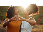 Love, heart and hand sign by lesbian, couple travel and bond in nature at sunset, happy and relax. Freedom, romance and black women embracing in celebration of their relationship with emoji hands