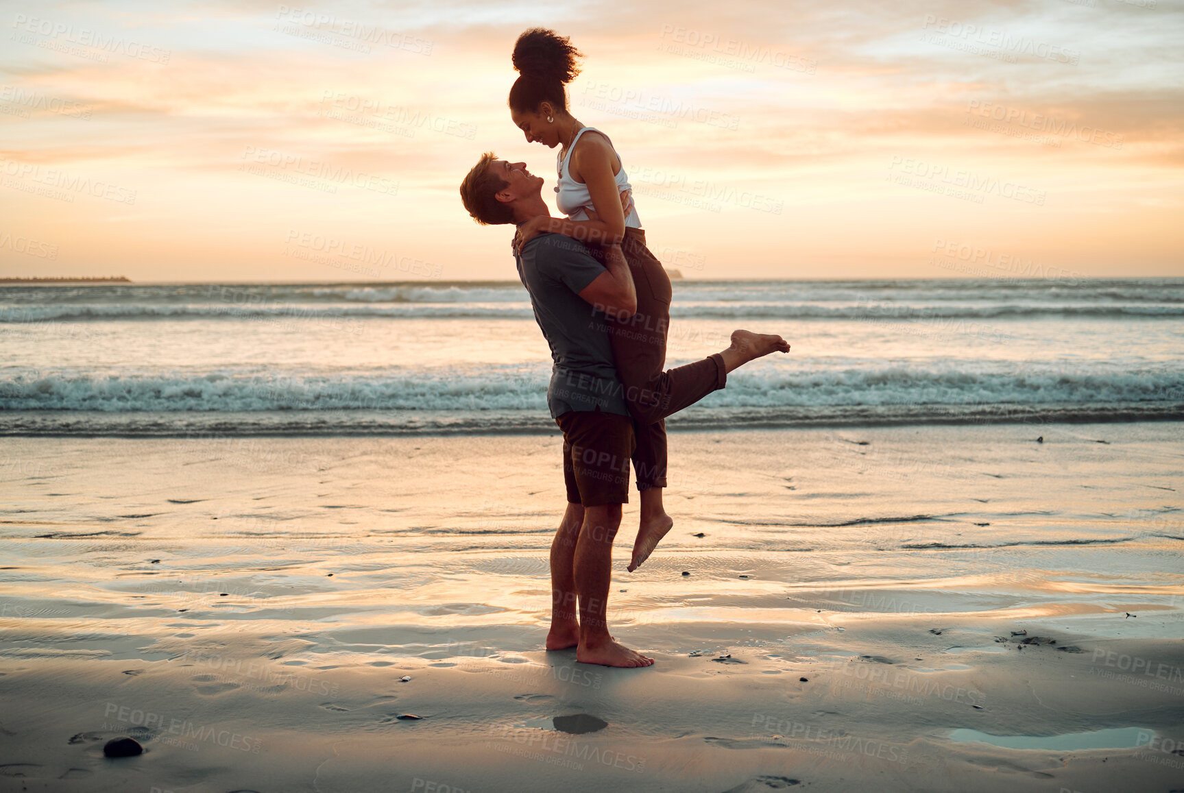 Buy stock photo Happy couple at beach hug and love celebration on romantic sunset tropical ocean water hawaii luxury vacation travel or holiday. Woman and man dating and celebration for engagement announcement
