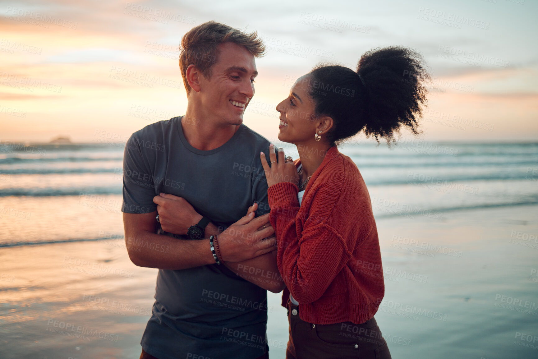 Buy stock photo Summer, love and couple at a beach on vacation, bonding and laughing while walking along the sea at sunset. Freedom, nature and travel by happy and relax man and woman enjoying romantic ocean walk