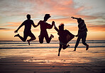 Friends, silhouette and jump on the beach during sunset on vacation together. Excited people on travel holiday in summer with fun, play and friendship in hawaii with group during journey or trip