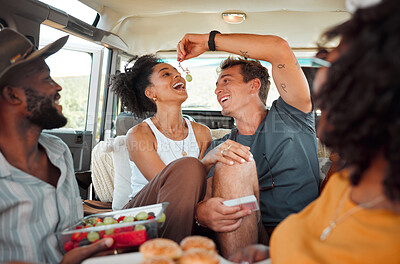 Buy stock photo Road trip, fruit and healthy couple eating in van for countryside lifestyle, travel or holiday camping journey. Relax friends or people with farm food, lunch or grapes and games in a caravan together