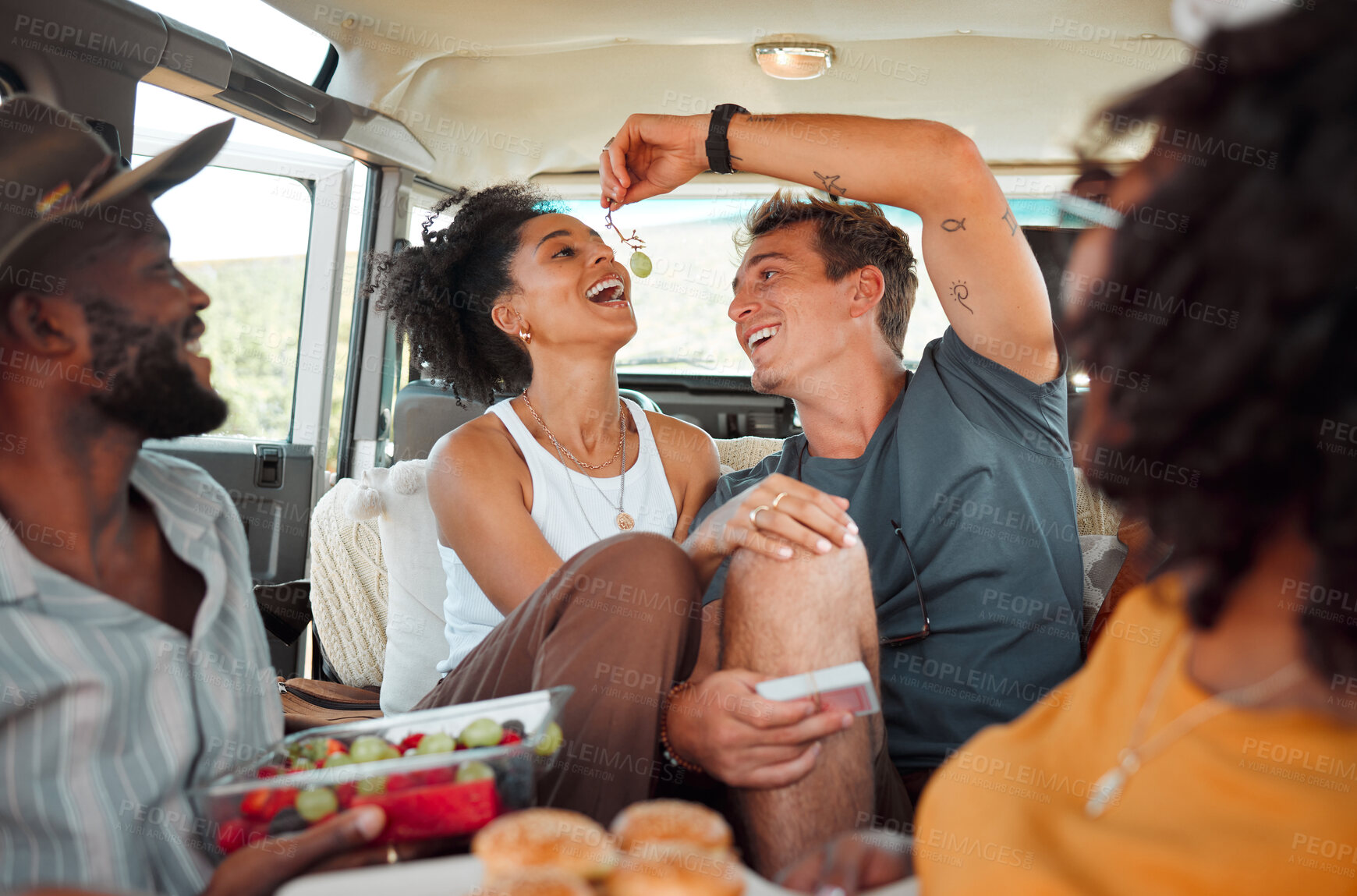 Buy stock photo Road trip, fruit and healthy couple eating in van for countryside lifestyle, travel or holiday camping journey. Relax friends or people with farm food, lunch or grapes and games in a caravan together