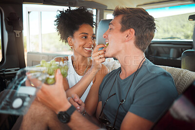 Buy stock photo Road trip, grapes and couple eating in van on travel journey, holiday or countryside date with love, care and diversity, Friends camper people and farm fruit food for healthy lifestyle in a caravan