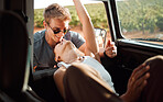 Love, couple and car road trip in nature on vacation, holiday or summer trip. Travel, interracial woman and man spending time together, affection and bonding, care and romance in countryside outdoors