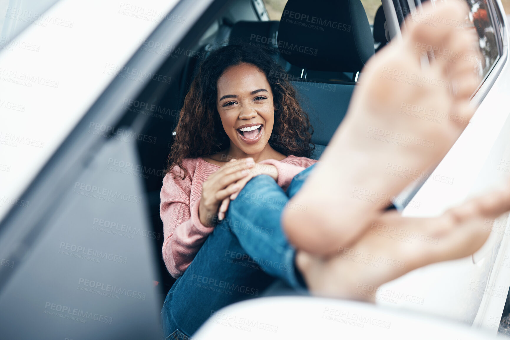 Buy stock photo Portrait of woman with feet out window of car, sitting with smile on face. Travel, freedom and weekend holiday on a road for adventure. Young girl, barefoot and happy on roadtrip for summer vacation