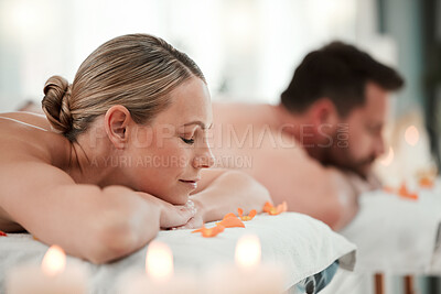 Relax, spa and woman on massage bed table for luxury messaging, zen and calm on vacation with man in hotel resort. Couple, health and body wellness, therapy or body care treatment on holiday together