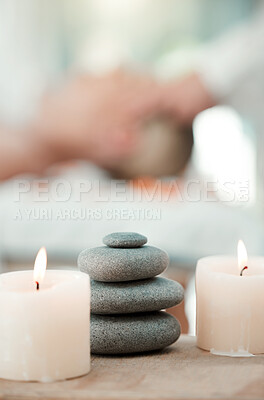 Buy stock photo Spa, rock and candle to relax in a room with atmosphere, mood or ambience in a health club. Wellness, luxury and treatment with still life objects on a table in a clinic for rest and relaxation