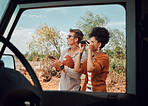 Nature, safari and a couple with binoculars on adventure summer holiday in African game reserve. Love, trees and a man and woman on a bush tour in sunshine, sightseeing and travel in South Africa.