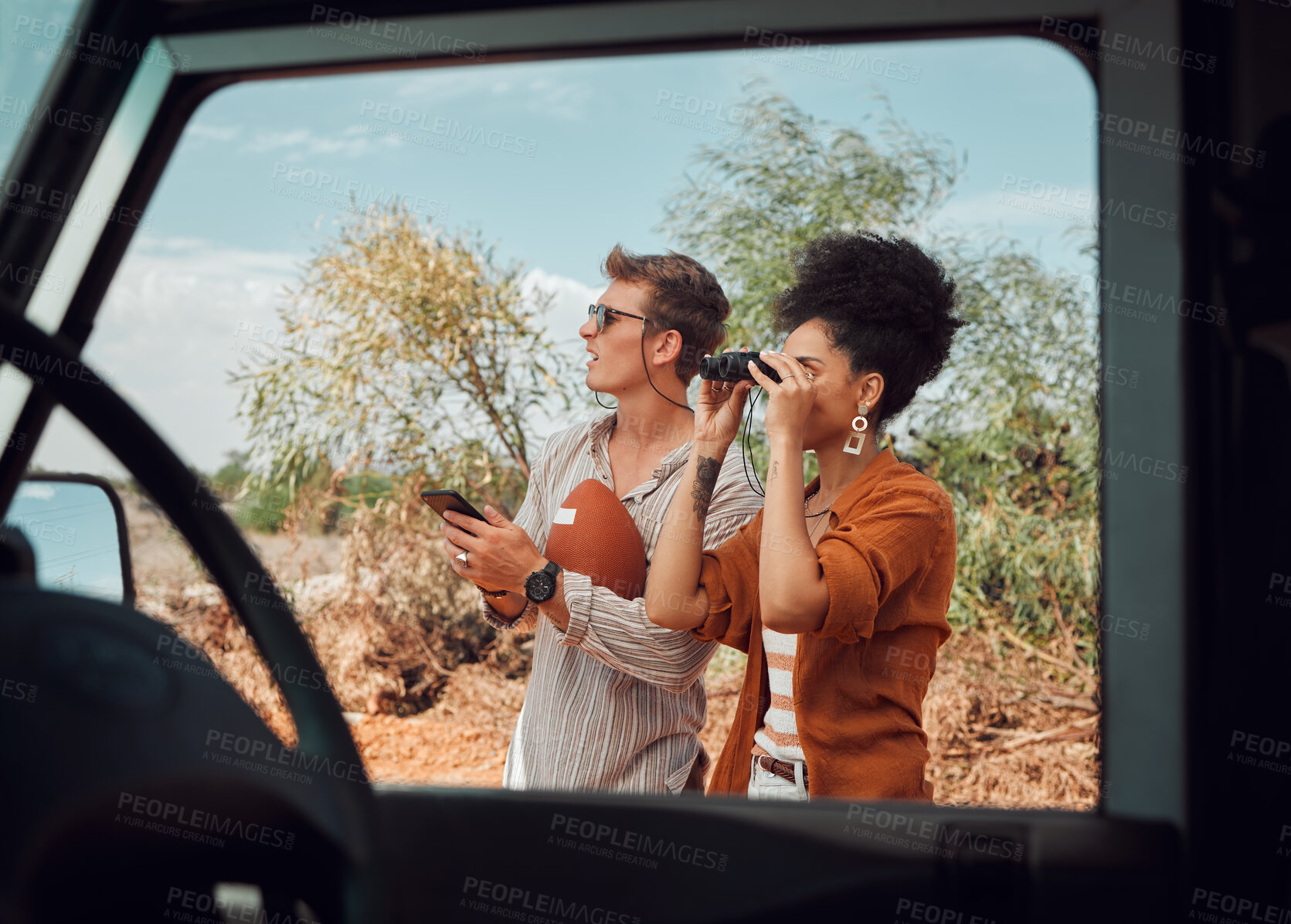 Buy stock photo Nature, safari and a couple with binoculars on adventure summer holiday in African game reserve. Love, trees and a man and woman on a bush tour in sunshine, sightseeing and travel in South Africa.