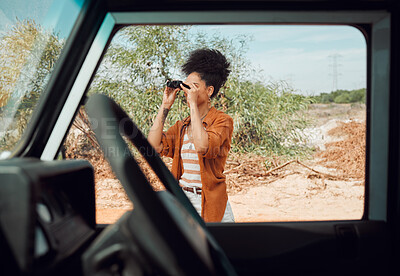 Buy stock photo Black woman with binocular for view, travel and adventure on road trip in countryside desert. Transportation for safari, outdoor journey in nature and young person with traveling lifestyle.
