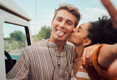 Buy stock photo Selfie, kiss and couple taking a picture on a road trip, having fun on a traveling adventure together. Love, nature and black woman kissing man for photo, bond in romantic moment in the countryside 