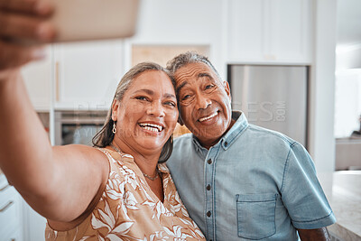 Buy stock photo Selfie, senior couple and happy in kitchen at home being romantic, fun and smile together for anniversary. Retirement, elderly man and woman being loving, bonding or relax indoors for love or romance