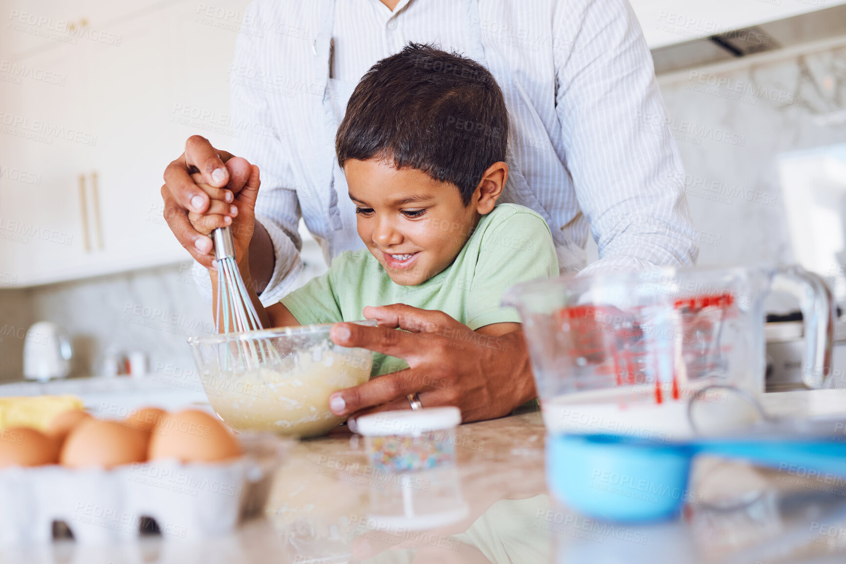 Buy stock photo Baking, kid and father in kitchen learning to make cake, cookies or biscuits in home. Support, care and bonding with parent teaching boy how to cook, bake and cooking with eggs, wheat flour and milk
