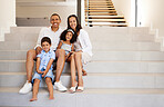 Family, stairs and smile in new home, property or mansion together for mockup portrait. Parents, children and happy in luxury house, real estate or apartment with happiness on face while on staircase