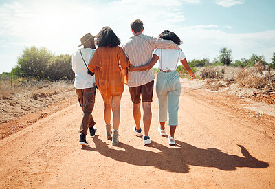 Buy stock photo Walking, hug and friends on safari holiday in Africa together in nature during summer. Back of a group of people hugging on a walk in the road for adventure in countryside or desert during vacation