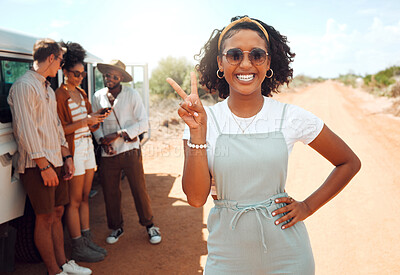 Buy stock photo Hand, peace and travel with a black woman on a road trip with her friends and a car outdoor in nature on a dessert sand road. Summer, transport and vacation with a young female showing a sign