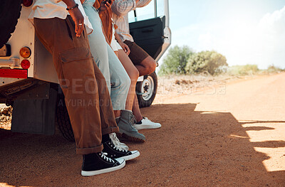 Buy stock photo Legs, travel and friends on a road trip with a car for holiday in Kenya together during summer. Feet of a group of people on vacation for adventure, freedom and peace with a car in the countryside