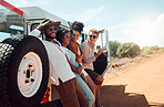 Friends, road trip and nature with a man and woman group enjoying travel while on summer holiday or vacation. Diversity, together and freedom with young people on a sand road in the dessert for fun