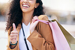 Happy, shopping and a thumbs up, woman with a smile and fashion sale bag over shoulder. Success, winner discount sales and retail therapy, a lady from Brazil smiling with shopping bag and happiness.