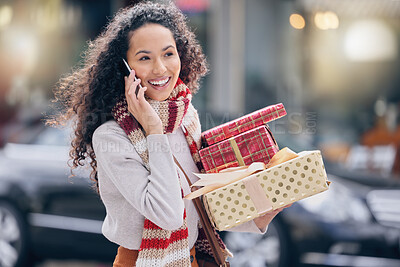 Buy stock photo Woman, christmas shopping and phone call in the city in communication with rich lifestyle outdoor. Female with retail gift in conversation with smile and laugh on mobile smartphone in the a market