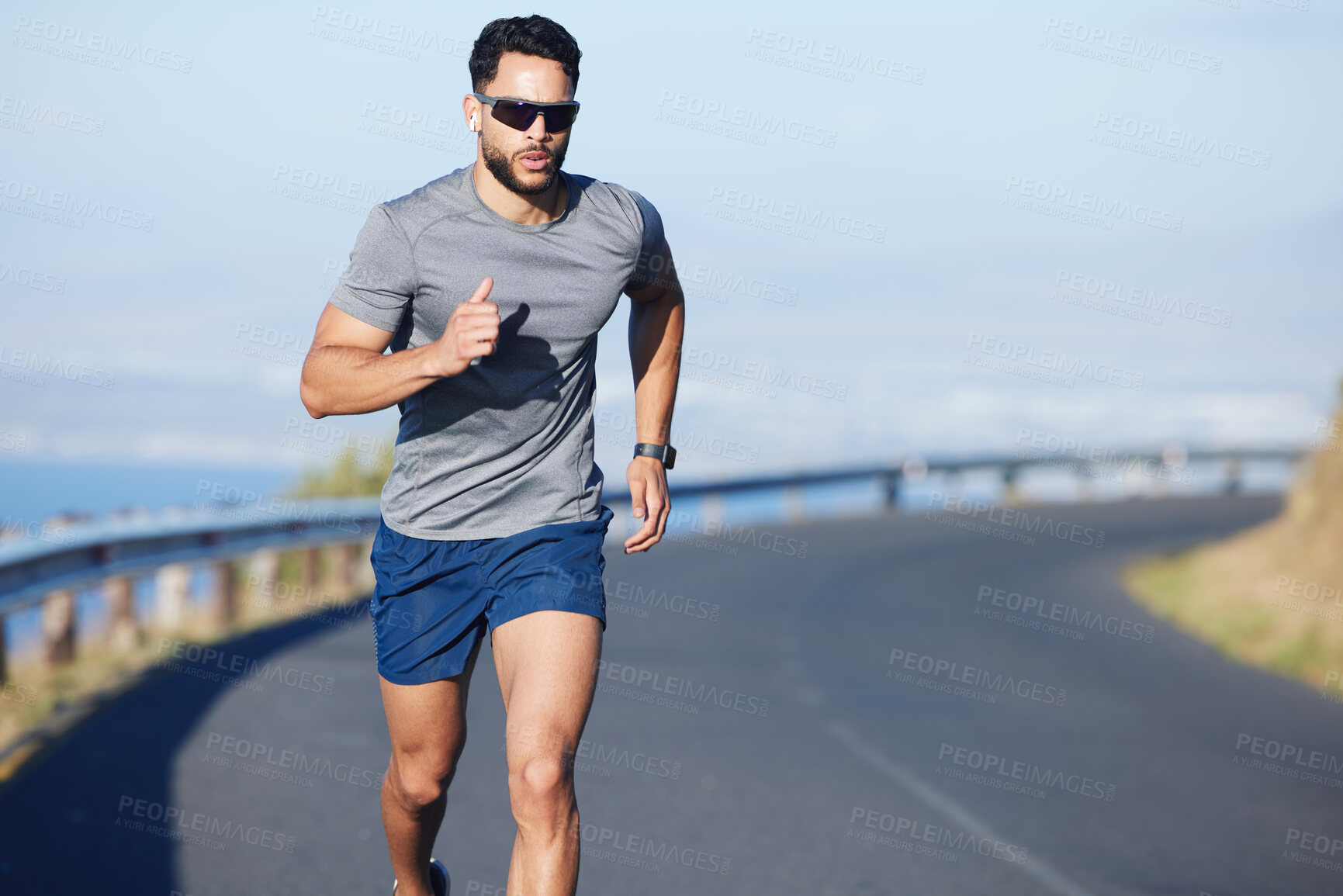 Buy stock photo Training, exercise and man running on road in city in summer with ocean background. Fitness, sports and runner with watch on the mountain in South Africa. Exercising, cardio and workout for athlete