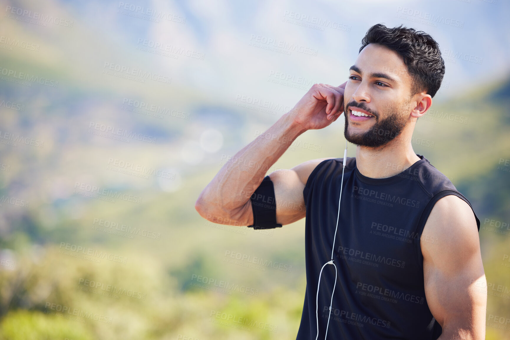 Buy stock photo Fitness, man and runner with earphones in nature with smile for healthy, exercise and training mockup. Happy athletic male smiling in sport workout for cardio wellness, health and music in outdoors