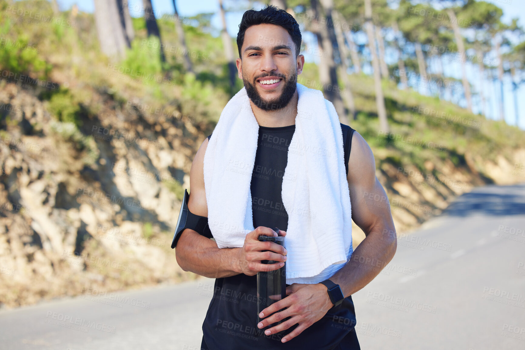 Buy stock photo Portrait, fitness and man with water on the street of Los Angeles after doing cardio training in nature. Happy, asmile and relax athlete runner with drink after running and workout on the road