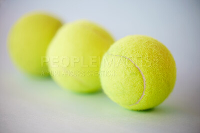 Sport, tennis ball and fitness background for training, exercise and competitive match. Green, equipment and balls for athlete health and hobby with still life equipment on the floor ready for a game