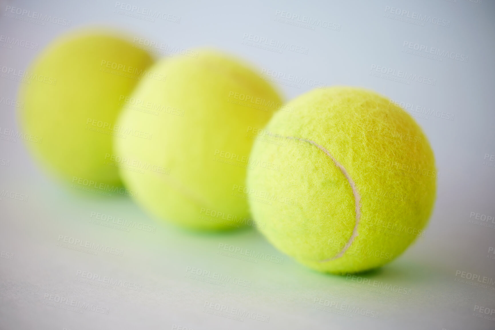 Buy stock photo Sport, tennis ball and fitness background for training, exercise and competitive match. Green, equipment and balls for athlete health and hobby with still life equipment on the floor ready for a game