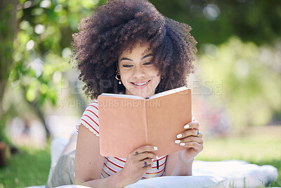 Buy stock photo Book, park and black woman reading a story to relax on a picnic in a field during summer. Happy, young and African girl with knowledge from literature for peace and calm on the grass in nature