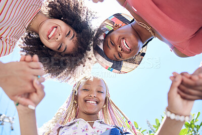 Buy stock photo Girl, friends and circle below holding hands together for solidarity, trust and happiness. Black woman, group and huddle with smile, unity and face look on face together for fun, vacation or holiday