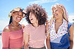 Beach, vacation and summer with a black woman and her friends enjoying a trip on he coast during their holiday. Travel, fun and a girl friend group outdoor together to relax while laughing or joking