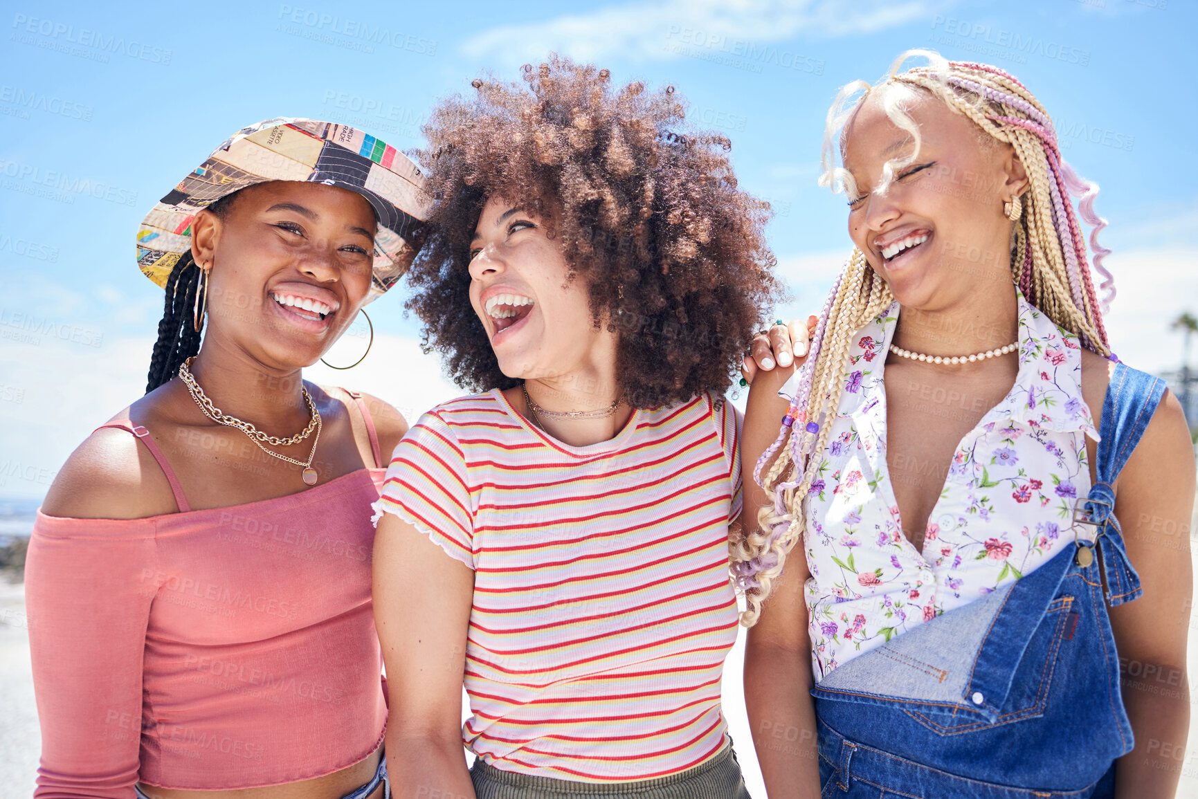 Buy stock photo Beach, vacation and summer with a black woman and her friends enjoying a trip on the coast during their holiday. Travel, fun and a girl friend group outdoor together to relax while laughing or joking
