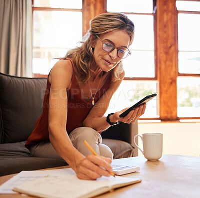 Buy stock photo Senior woman, phone and writing calculation in book on sofa, web search or investment planning. Retirement, elderly female and 5g mobile, internet banking or budget and savings with coffee in house.