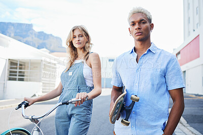 Buy stock photo Bike, skate and portrait of urban couple, gen z street fashion and outdoor activity. Young city man and woman, streetwear and alternative transport, carbon neutral travel with skateboard and bicycle.
