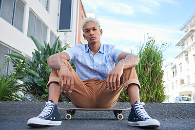 Buy stock photo Skateboard, gen z and cool skater man in the city with a serious look outdoor. Portrait of a urban person from Mexico relax after skate training, fitness and cardio workout practice on the road 