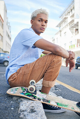 Buy stock photo Skateboard, street style and city with a black man on the sidewalk in the day for skating, sport or leisure. Skater, recreation and urban with a cool or edgy male sitting on a pavement with his board