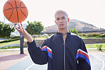 Fashion, court and man spinning a basketball on the sports ground before a training, exercise or cardio workout outdoors. Portrait, balance and young player in a cool urban jacket with ball on finger