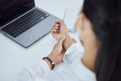 Buy stock photo Business woman with a wrist injury, pain or accident from typing or stress sitting by a desk in her office. Girl with muscle sprain, inflammation or carpal tunnel with medical emergency at workplace.