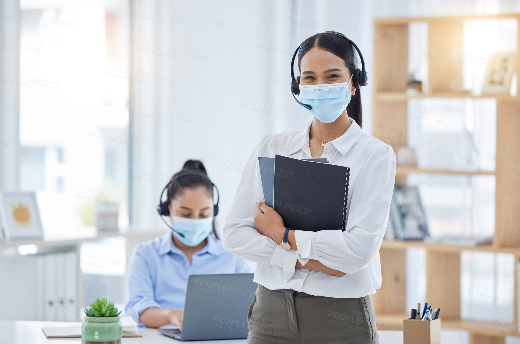 Buy stock photo Covid, receptionist in a mask at office and professional business secretary working through pandemic. Corporate woman employees, during coronavirus epidemic and focus on health or safety at workplace