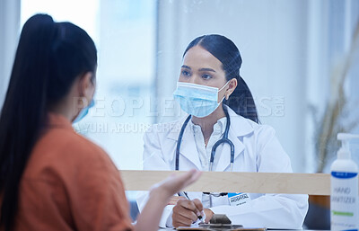 Buy stock photo Consulting doctor, woman and covid face mask in hospital, medical healthcare and Brazilian wellness clinic with patient. Medicine worker, employee or covid 19 insurance help people talking in checkup
