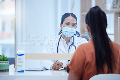 Buy stock photo Covid, consulting and doctor and woman at desk and glass window for help, medical and therapy in clinic. Safety, medicine and checklist with patient and healthcare professional in counseling room 