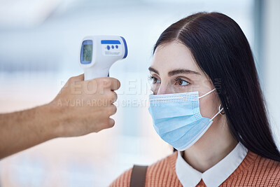 Buy stock photo Thermometer, healthcare and covid with a doctor scan a patient temperature with infrared, checking for a fever. Sick woman with mask for corona, flu or cold in exam or consult in a medical clinic