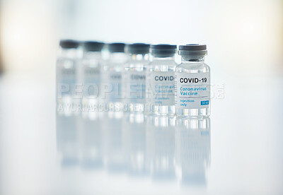 Buy stock photo Healthcare, medicine and covid vaccine bottle, stock and product in a hospital office. Healthcare with a virus cure, wellness or corona drug in a medical research clinic for safety from covid 19 